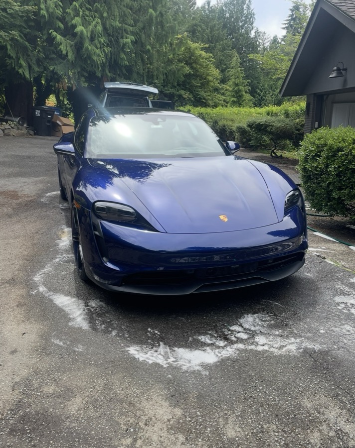 Exterior detail — Porsche Taycan after a full hand wash and wax