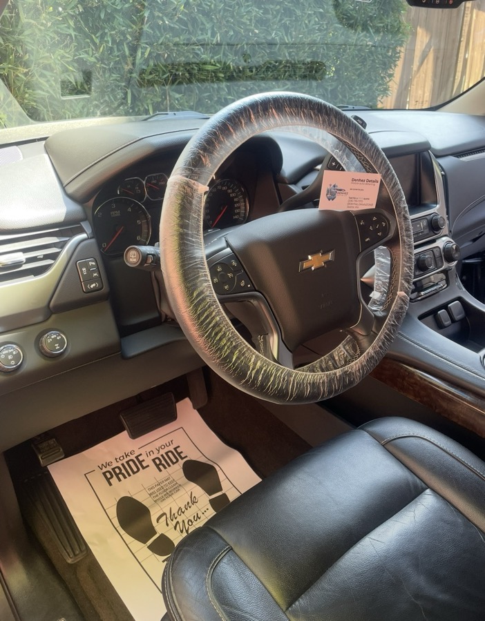 Interior detail — freshly shampooed seats and carpets with thank-you mat